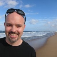 Chez smiles on a beach