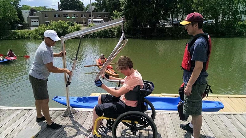 Woman in wheelchair prepares to kayak
