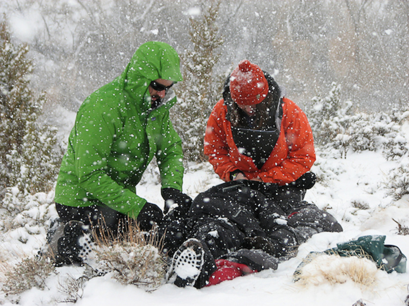 two men respond to incident in the snow. photo credit to marcio paes barreto